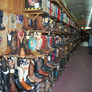Bray's Saddlery wall of boots entering the store 